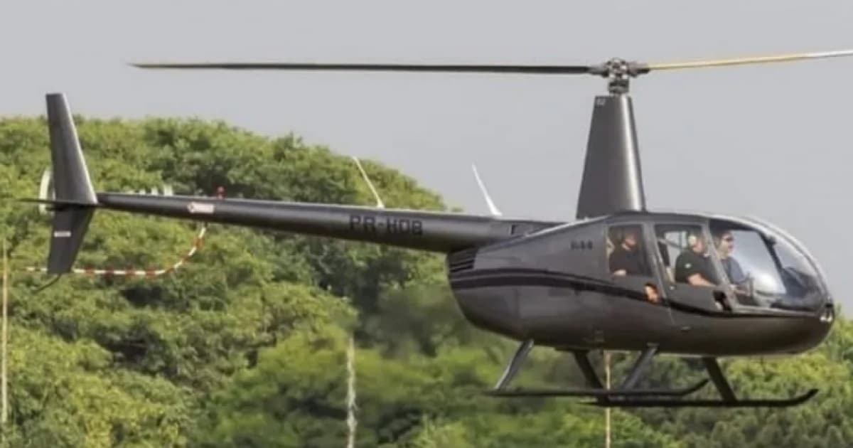 Família de piloto faz buscas paralelas por helicóptero em área de mata